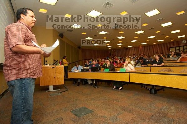 Gonzalo Zapata, the electrical and mechanical facilities director, presenting how they can help, at the Engineering Council meeting, Monday, February 19, 2007.

Filename: SRM_20070219_1909581.jpg
Aperture: f/6.3
Shutter Speed: 1/50
Body: Canon EOS-1D Mark II
Lens: Sigma 15-30mm f/3.5-4.5 EX Aspherical DG DF