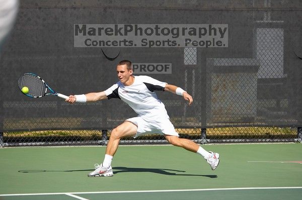 Texas' Dimitar Kutrovsky defeated Tech's Jose Muguruza 6-2 and 6-3. The University of Texas (UT) men's tennis team defeated Georgia Tech (GT) Saturday, February 24, 2007..
Filename: SRM_20070224_1412262.jpg
Aperture: f/4.0
Shutter Speed: 1/4000
Body: Canon EOS-1D Mark II
Lens: Canon EF 80-200mm f/2.8 L