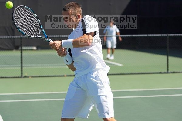 Texas' Dimitar Kutrovsky defeated Tech's Jose Muguruza 6-2 and 6-3.  The University of Texas (UT) men's tennis team defeated Georgia Tech (GT) Saturday, February 24, 2007..

Filename: SRM_20070224_1420028.jpg
Aperture: f/4.0
Shutter Speed: 1/3200
Body: Canon EOS-1D Mark II
Lens: Canon EF 80-200mm f/2.8 L