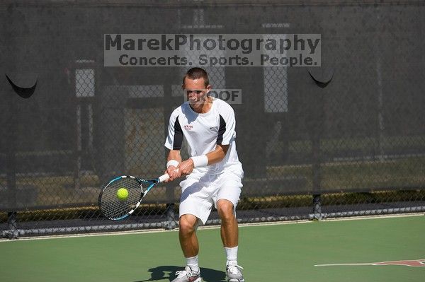 Texas' Dimitar Kutrovsky defeated Tech's Jose Muguruza 6-2 and 6-3. The University of Texas (UT) men's tennis team defeated Georgia Tech (GT) Saturday, February 24, 2007..
Filename: SRM_20070224_1430082.jpg
Aperture: f/4.0
Shutter Speed: 1/8000
Body: Canon EOS-1D Mark II
Lens: Canon EF 80-200mm f/2.8 L