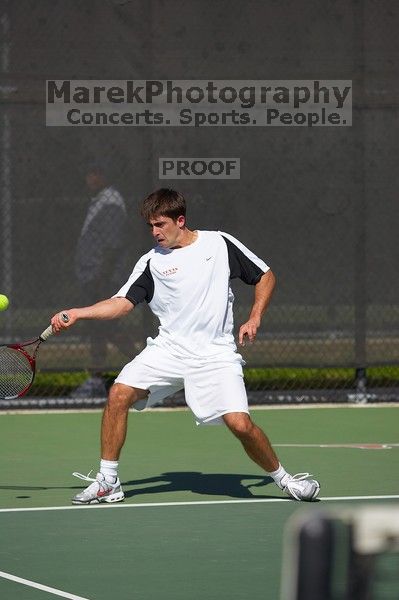 Milan Mihailovic (UT) defeated Jordan DeLass (GT) 6-4, 6-4.  The University of Texas (UT) men's tennis team defeated Georgia Tech (GT) Saturday, February 24, 2007..

Filename: SRM_20070224_1440085.jpg
Aperture: f/4.0
Shutter Speed: 1/8000
Body: Canon EOS-1D Mark II
Lens: Canon EF 80-200mm f/2.8 L