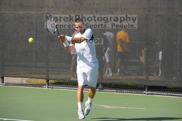 Texas' Dimitar Kutrovsky defeated Tech's Jose Muguruza 6-2 and 6-3. The University of Texas (UT) men's tennis team defeated Georgia Tech (GT) Saturday, February 24, 2007..
Filename: SRM_20070224_1455222.jpg
Aperture: f/4.0
Shutter Speed: 1/4000
Body: Canon EOS-1D Mark II
Lens: Canon EF 80-200mm f/2.8 L