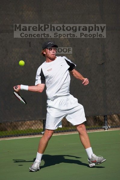 Rook Schellenberg (UT) defeated George Gvelesiani (GT) 6-3, 7-6.  The University of Texas (UT) men's tennis team defeated Georgia Tech (GT) Saturday, February 24, 2007..

Filename: SRM_20070224_1512025.jpg
Aperture: f/4.0
Shutter Speed: 1/4000
Body: Canon EOS-1D Mark II
Lens: Canon EF 80-200mm f/2.8 L