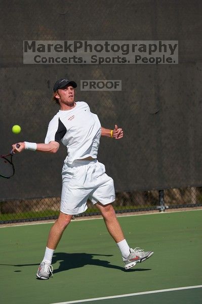 Rook Schellenberg (UT) defeated George Gvelesiani (GT) 6-3, 7-6.  The University of Texas (UT) men's tennis team defeated Georgia Tech (GT) Saturday, February 24, 2007..
Filename: SRM_20070224_1512107.jpg
Aperture: f/4.0
Shutter Speed: 1/4000
Body: Canon EOS-1D Mark II
Lens: Canon EF 80-200mm f/2.8 L