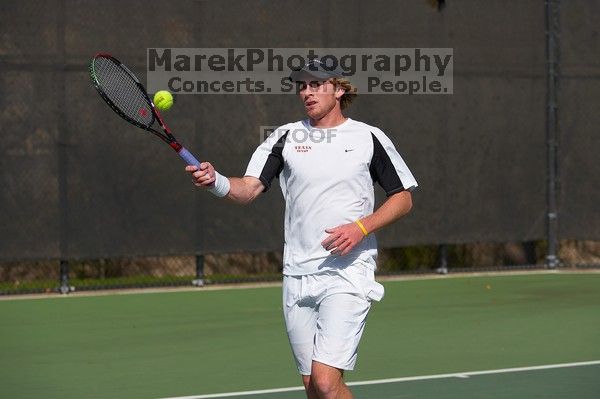 Rook Schellenberg (UT) defeated George Gvelesiani (GT) 6-3, 7-6. The University of Texas (UT) men's tennis team defeated Georgia Tech (GT) Saturday, February 24, 2007..
Filename: SRM_20070224_1514328.jpg
Aperture: f/4.0
Shutter Speed: 1/4000
Body: Canon EOS-1D Mark II
Lens: Canon EF 80-200mm f/2.8 L
