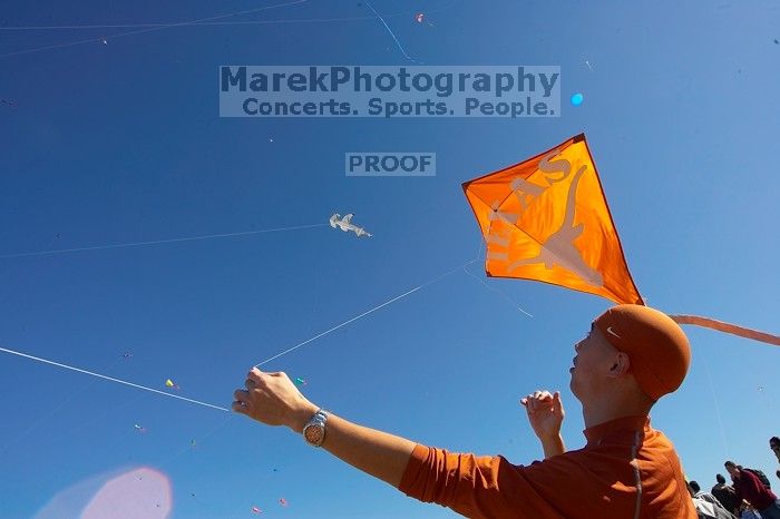 Chris Lam attempts to fly his UT kite at the 79th annual Zilker Park Kite Festival, Sunday, March 4, 2007.
Filename: SRM_20070304_1531584.jpg
Aperture: f/11.0
Shutter Speed: 1/250
Body: Canon EOS-1D Mark II
Lens: Sigma 15-30mm f/3.5-4.5 EX Aspherical DG DF