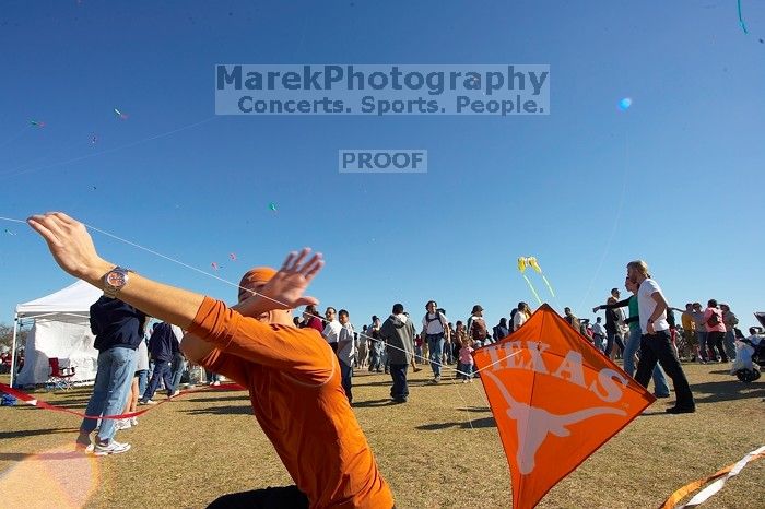 Chris Lam attempts to fly his UT kite at the 79th annual Zilker Park Kite Festival, Sunday, March 4, 2007.
Filename: SRM_20070304_1532028.jpg
Aperture: f/11.0
Shutter Speed: 1/250
Body: Canon EOS-1D Mark II
Lens: Sigma 15-30mm f/3.5-4.5 EX Aspherical DG DF