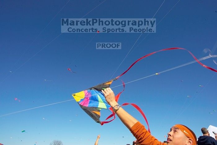 Chris Lam attempts to fly his UT kite at the 79th annual Zilker Park Kite Festival, Sunday, March 4, 2007.
Filename: SRM_20070304_1532103.jpg
Aperture: f/11.0
Shutter Speed: 1/250
Body: Canon EOS-1D Mark II
Lens: Sigma 15-30mm f/3.5-4.5 EX Aspherical DG DF