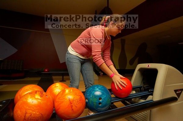 Laura Fair reaching for a bowling ball. Alpha Xi Delta held a sock hop themed date night at the Austin 300 bowling alley, Thursday night, March 29, 2007.
Filename: SRM_20070329_2022483.jpg
Aperture: f/8.0
Shutter Speed: 1/200
Body: Canon EOS-1D Mark II
Lens: Sigma 15-30mm f/3.5-4.5 EX Aspherical DG DF