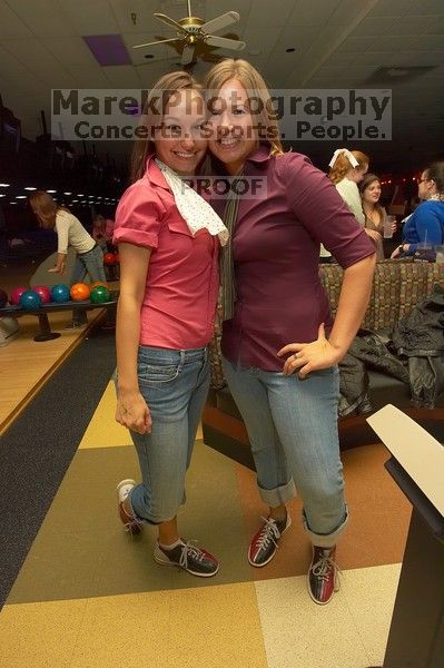 Jessica Schreyer and Melissa Mabry (right).  Alpha Xi Delta held a sock hop themed date night at the Austin 300 bowling alley, Thursday night, March 29, 2007.

Filename: SRM_20070329_2132465.jpg
Aperture: f/8.0
Shutter Speed: 1/250
Body: Canon EOS-1D Mark II
Lens: Sigma 15-30mm f/3.5-4.5 EX Aspherical DG DF