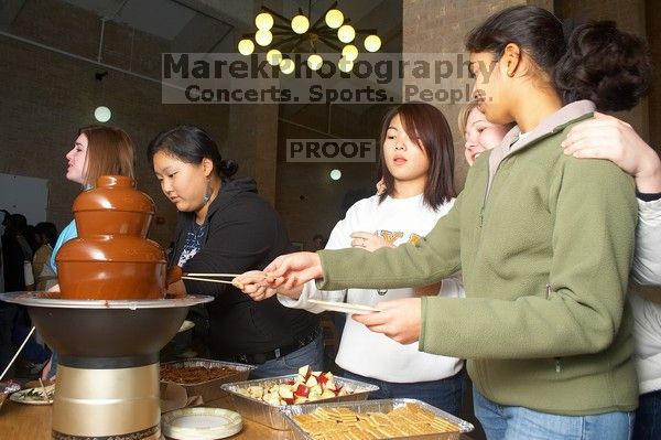 Quinglan Yu and Mukta Pendharkar. The Asian Business Students Association (ABSA) hosted a chocolate fondue Friday, January 26, 2007 before heading off to a movie premier.
Filename: SRM_20070126_1619323.jpg
Aperture: f/5.6
Shutter Speed: 1/125
Body: Canon EOS 20D
Lens: Canon EF-S 18-55mm f/3.5-5.6