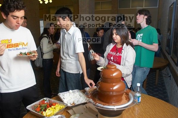 D'Andra Thomas-Jackson, Ian McCoy, and Christina Canales enjoy the chocolate fondue.  The Asian Business Students Association (ABSA) hosted a chocolate fondue Friday, January 26, 2007 before heading off to a movie premier.

Filename: SRM_20070126_1622568.jpg
Aperture: f/5.0
Shutter Speed: 1/125
Body: Canon EOS 20D
Lens: Canon EF-S 18-55mm f/3.5-5.6