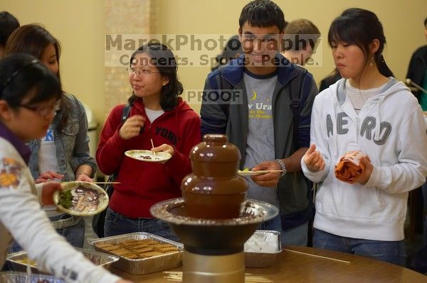 Nalin Verma and Taeyoung Kim. The Asian Business Students Association (ABSA) hosted a chocolate fondue Friday, January 26, 2007 before heading off to a movie premier.
Filename: SRM_20070126_1651545.jpg
Aperture: f/2.0
Shutter Speed: 1/50
Body: Canon EOS-1D Mark II
Lens: Canon EF 50mm f/1.8 II