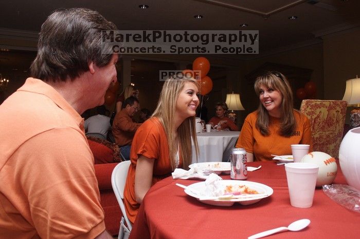 Tahnae Tarkenton eats lunch with her parents.  Kappa Kappa Gamma (KKG) hosted a parents' weekend barbecue before the UT vs Nebraska football game on Saturday, October 27, 2007 at their sorority house.

Filename: SRM_20071027_1137007.jpg
Aperture: f/8.0
Shutter Speed: 1/100
Body: Canon EOS 20D
Lens: Canon EF-S 18-55mm f/3.5-5.6