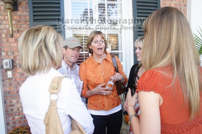 Cece Cohen (in red) with her parents and Callie Brown and her parents. Kappa Kappa Gamma (KKG) hosted a parents' weekend barbecue before the UT vs Nebraska football game on Saturday, October 27, 2007 at their sorority house.
Filename: SRM_20071027_1232005.jpg
Aperture: f/8.0
Shutter Speed: 1/30
Body: Canon EOS 20D
Lens: Canon EF-S 18-55mm f/3.5-5.6