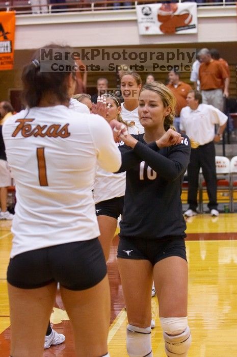 UT senior Alyson Jennings (#16, L) bumps arms with UT freshman Juliann Faucette (#1, OH) before the game.  The Longhorns defeated the Huskers 3-0 on Wednesday night, October 24, 2007 at Gregory Gym.

Filename: SRM_20071024_1832141.jpg
Aperture: f/3.5
Shutter Speed: 1/400
Body: Canon EOS-1D Mark II
Lens: Canon EF 80-200mm f/2.8 L