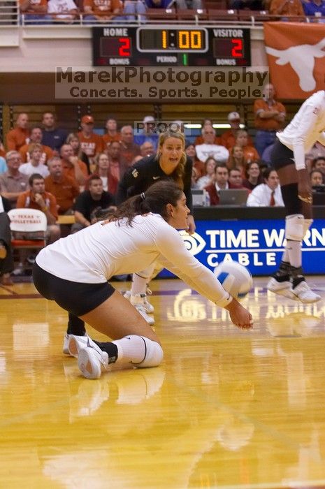 UT freshman Juliann Faucette (#1, OH) stretches out for the dig as UT senior Alyson Jennings (#16, L) watches.  The Longhorns defeated the Huskers 3-0 on Wednesday night, October 24, 2007 at Gregory Gym.

Filename: SRM_20071024_1839141.jpg
Aperture: f/4.0
Shutter Speed: 1/400
Body: Canon EOS-1D Mark II
Lens: Canon EF 80-200mm f/2.8 L