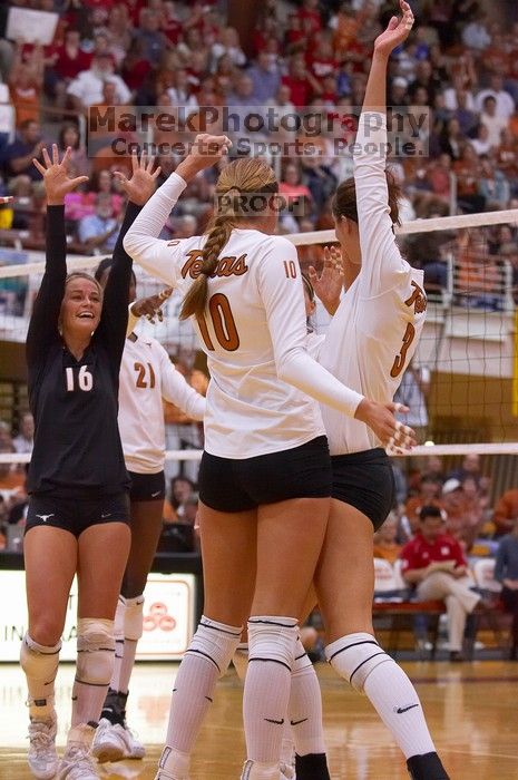 UT sophomore Ashley Engle (#10, S/RS), UT sophomore Destinee Hooker (#21, OH), UT senior Michelle Moriarty (#4, S), UT junior Lauren Paolini (#3, UTIL), and UT senior Alyson Jennings (#16, L) celebrate after a point. The Longhorns defeated the Huskers 3-0
Filename: SRM_20071024_1841582.jpg
Aperture: f/4.0
Shutter Speed: 1/400
Body: Canon EOS-1D Mark II
Lens: Canon EF 80-200mm f/2.8 L