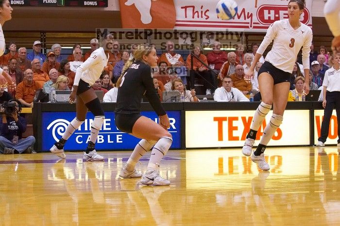 UT senior Alyson Jennings (#16, L) hits the ball as UT sophomore Destinee Hooker (#21, OH) and UT junior Lauren Paolini (#3, UTIL) watch. The Longhorns defeated the Huskers 3-0 on Wednesday night, October 24, 2007 at Gregory Gym.
Filename: SRM_20071024_1846340.jpg
Aperture: f/4.0
Shutter Speed: 1/400
Body: Canon EOS-1D Mark II
Lens: Canon EF 80-200mm f/2.8 L