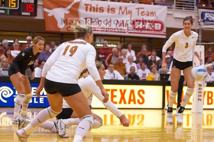 UT sophomore Ashley Engle (#10, S/RS) waits to hit the ball as UT senior Alyson Jennings (#16, L), UT sophomore Heather Kisner (#19, DS), and UT junior Lauren Paolini (#3, UTIL) watch. The Longhorns defeated the Huskers 3-0 on Wednesday night, October 24,
Filename: SRM_20071024_1852040.jpg
Aperture: f/4.0
Shutter Speed: 1/400
Body: Canon EOS-1D Mark II
Lens: Canon EF 80-200mm f/2.8 L