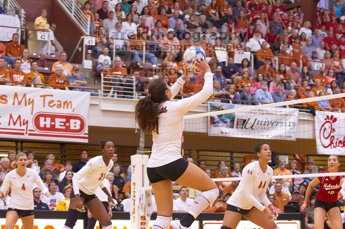 UT freshman Juliann Faucette (#1, OH) sets the ball as UT senior Michelle Moriarty (#4, S), UT sophomore Destinee Hooker (#21, OH), UT senior Brandy Magee (#44, MB), and Nebraska junior Jordan Larson (#10, OH) watch. The Longhorns defeated the Huskers 3-0
Filename: SRM_20071024_1900103.jpg
Aperture: f/4.0
Shutter Speed: 1/200
Body: Canon EOS-1D Mark II
Lens: Canon EF 80-200mm f/2.8 L