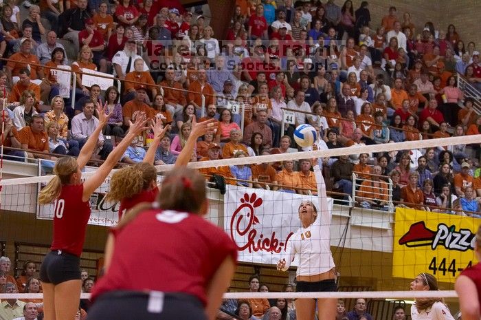 UT sophomore Ashley Engle (#10, S/RS) spikes towards Nebraska junior Jordan Larson (#10, OH) as UT senior Michelle Moriarty (#4, S) and Nebraska senior Sarah Pavan (#9, RS) watch.  The Longhorns defeated the Huskers 3-0 on Wednesday night, October 24, 2007

Filename: SRM_20071024_1915286.jpg
Aperture: f/4.0
Shutter Speed: 1/400
Body: Canon EOS-1D Mark II
Lens: Canon EF 80-200mm f/2.8 L