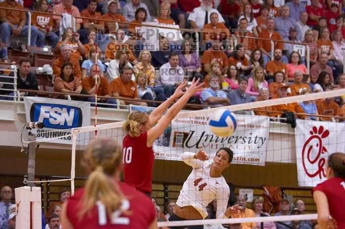 UT senior Brandy Magee (#44, MB) spikes past Nebraska junior Jordan Larson (#10, OH) as Nebraska sophomore Rachel Holloway (#12, S) and Nebraska sophomore Kori Cooper (#15, MB) wait.  The Longhorns defeated the Huskers 3-0 on Wednesday night, October 24, 2

Filename: SRM_20071024_1917342.jpg
Aperture: f/3.5
Shutter Speed: 1/400
Body: Canon EOS-1D Mark II
Lens: Canon EF 80-200mm f/2.8 L