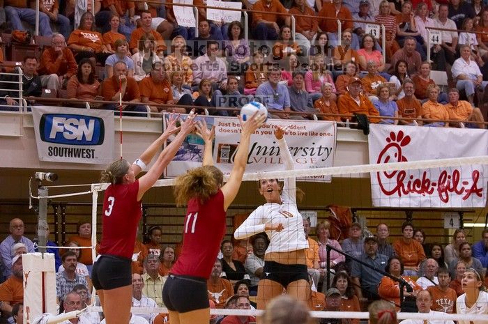 UT sophomore Ashley Engle (#10, S/RS) hits the ball past blockers Nebraska senior Christina Houghtelling (#3, OH) and Nebraska senior Tracy Stalls (#11, MB). The Longhorns defeated the Huskers 3-0 on Wednesday night, October 24, 2007 at Gregory Gym.
Filename: SRM_20071024_1928481.jpg
Aperture: f/4.0
Shutter Speed: 1/400
Body: Canon EOS-1D Mark II
Lens: Canon EF 80-200mm f/2.8 L