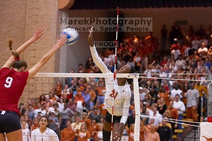 UT sophomore Destinee Hooker (#21, OH) hits the ball past Nebraska senior Sarah Pavan (#9, RS) as UT freshman Juliann Faucette (#1, OH) watches.  The Longhorns defeated the Huskers 3-0 on Wednesday night, October 24, 2007 at Gregory Gym.

Filename: SRM_20071024_1937427.jpg
Aperture: f/4.0
Shutter Speed: 1/320
Body: Canon EOS-1D Mark II
Lens: Canon EF 80-200mm f/2.8 L