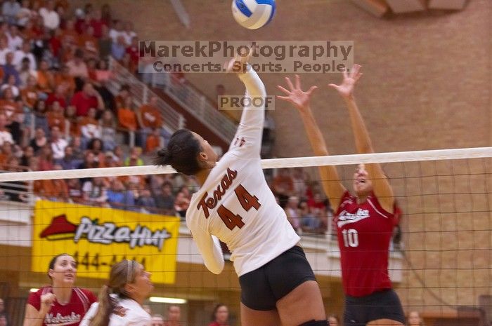 UT senior Brandy Magee (#44, MB) spikes past Nebraska junior Jordan Larson (#10, OH) as UT senior Michelle Moriarty (#4, S) watches.  The Longhorns defeated the Huskers 3-0 on Wednesday night, October 24, 2007 at Gregory Gym.

Filename: SRM_20071024_1950061.jpg
Aperture: f/4.0
Shutter Speed: 1/320
Body: Canon EOS-1D Mark II
Lens: Canon EF 80-200mm f/2.8 L