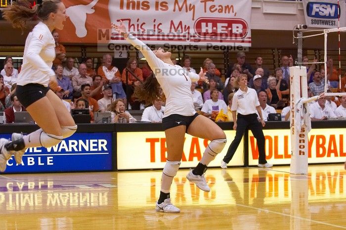 UT junior Kiley Hall (#11, DS/L) and UT freshman Juliann Faucette (#1, OH) are ecstatic after a point. The Longhorns defeated the Huskers 3-0 on Wednesday night, October 24, 2007 at Gregory Gym.
Filename: SRM_20071024_1954467.jpg
Aperture: f/4.0
Shutter Speed: 1/400
Body: Canon EOS-1D Mark II
Lens: Canon EF 80-200mm f/2.8 L