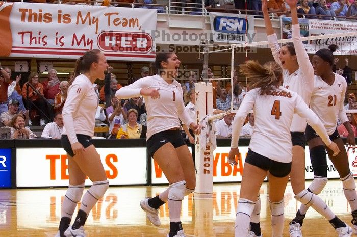 UT junior Kiley Hall (#11, DS/L), UT freshman Juliann Faucette (#1, OH), UT senior Michelle Moriarty (#4, S), UT junior Lauren Paolini (#3, UTIL) and UT sophomore Destinee Hooker (#21, OH) are ecstatic after a point. The Longhorns defeated the Huskers 3-0
Filename: SRM_20071024_1954542.jpg
Aperture: f/4.0
Shutter Speed: 1/400
Body: Canon EOS-1D Mark II
Lens: Canon EF 80-200mm f/2.8 L