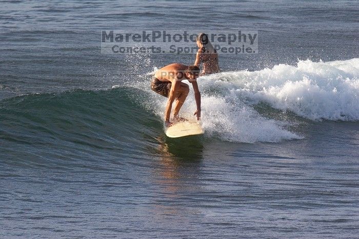 Surfers in Honolua Bay, Maui, Hawai'i, 2007.

Filename: SRM_20071217_1623376.jpg
Aperture: f/5.6
Shutter Speed: 1/1250
Body: Canon EOS 20D
Lens: Canon EF 300mm f/2.8 L IS