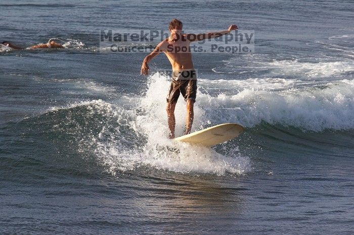 Surfers in Honolua Bay, Maui, Hawai'i, 2007.

Filename: SRM_20071217_1623399.jpg
Aperture: f/5.6
Shutter Speed: 1/1600
Body: Canon EOS 20D
Lens: Canon EF 300mm f/2.8 L IS
