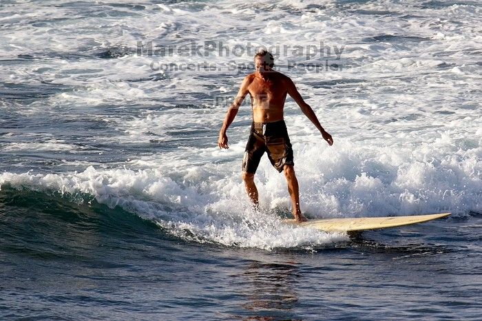 Surfers in Honolua Bay, Maui, Hawai'i, 2007.

Filename: SRM_20071217_1623411.jpg
Aperture: f/5.6
Shutter Speed: 1/1600
Body: Canon EOS 20D
Lens: Canon EF 300mm f/2.8 L IS