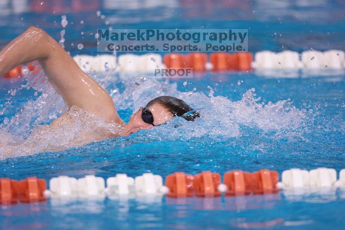 UT junior Michael Klueh won the 1000 yard freestyle with a time of 9:01.89.  The University of Texas Longhorns defeated The University of Georgia Bulldogs 157-135 on Saturday, January 12, 2008.

Filename: SRM_20080112_1108503.jpg
Aperture: f/2.8
Shutter Speed: 1/400
Body: Canon EOS-1D Mark II
Lens: Canon EF 300mm f/2.8 L IS