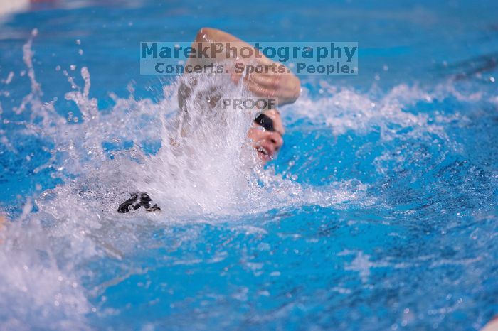 UT junior Michael Klueh won the 1000 yard freestyle with a time of 9:01.89.  The University of Texas Longhorns defeated The University of Georgia Bulldogs 157-135 on Saturday, January 12, 2008.

Filename: SRM_20080112_1110083.jpg
Aperture: f/2.8
Shutter Speed: 1/400
Body: Canon EOS-1D Mark II
Lens: Canon EF 300mm f/2.8 L IS