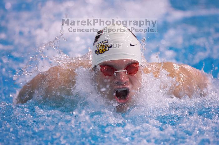 Georgia's Mark Dylla took third in the 200 yard butterfly with a time of 1:49.61. The University of Texas Longhorns defeated The University of Georgia Bulldogs 157-135 on Saturday, January 12, 2008.
Filename: SRM_20080112_1126520.jpg
Aperture: f/2.8
Shutter Speed: 1/400
Body: Canon EOS-1D Mark II
Lens: Canon EF 300mm f/2.8 L IS