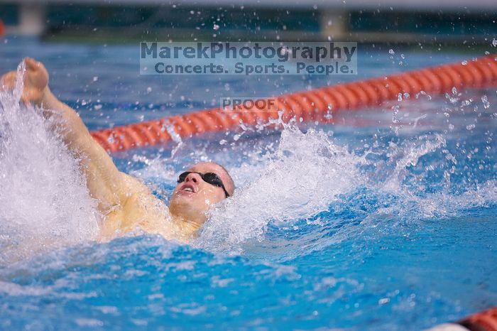 UT senior Matthew McGinnis took first in the 200 yard backstroke with a time of 1:47.37. The University of Texas Longhorns defeated The University of Georgia Bulldogs 157-135 on Saturday, January 12, 2008.
Filename: SRM_20080112_1159069.jpg
Aperture: f/2.8
Shutter Speed: 1/400
Body: Canon EOS-1D Mark II
Lens: Canon EF 300mm f/2.8 L IS