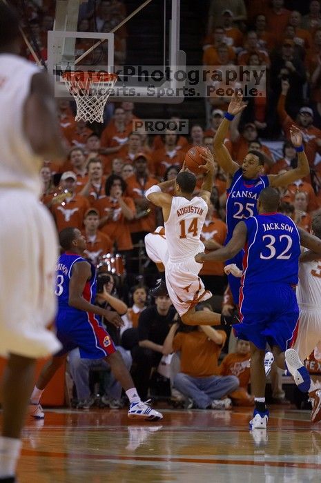 UT sophomore D.J. Augustin (#14, G) shoots over KU senior Russell Robinson (#3, Guard). The University of Texas (UT) Longhorns defeated the University of Kansas Jayhawks 72-69 in Austin, Texas on Monday, February 11, 2008.
Filename: SRM_20080211_2012400.jpg
Aperture: f/2.8
Shutter Speed: 1/640
Body: Canon EOS-1D Mark II
Lens: Canon EF 80-200mm f/2.8 L