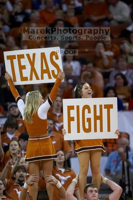 UT Cheerleaders rallying the fans at the Kansas game. The University of Texas (UT) Longhorns defeated the University of Kansas Jayhawks 72-69 in Austin, Texas on Monday, February 11, 2008.
Filename: SRM_20080211_2052124.jpg
Aperture: f/2.8
Shutter Speed: 1/640
Body: Canon EOS 20D
Lens: Canon EF 300mm f/2.8 L IS