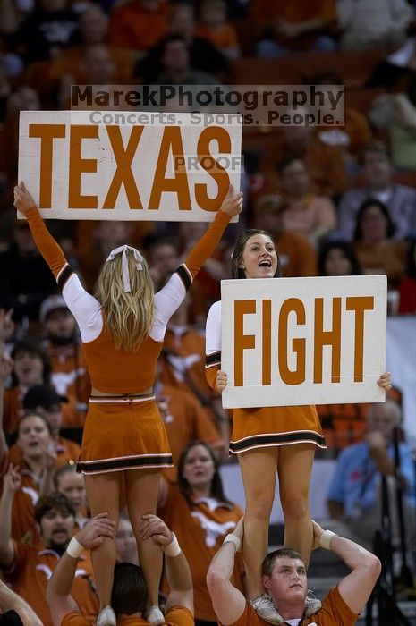 UT Cheerleaders rallying the fans at the Kansas game. The University of Texas (UT) Longhorns defeated the University of Kansas Jayhawks 72-69 in Austin, Texas on Monday, February 11, 2008.
Filename: SRM_20080211_2052240.jpg
Aperture: f/2.8
Shutter Speed: 1/640
Body: Canon EOS 20D
Lens: Canon EF 300mm f/2.8 L IS