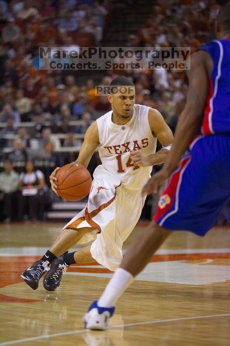 UT junior A.J. Abrams (#3, G) playing defense against a Kansas player.  The University of Texas (UT) Longhorns defeated the University of Kansas Jayhawks 72-69 in Austin, Texas on Monday, February 11, 2008.

Filename: SRM_20080211_2119387.jpg
Aperture: f/2.8
Shutter Speed: 1/640
Body: Canon EOS-1D Mark II
Lens: Canon EF 80-200mm f/2.8 L