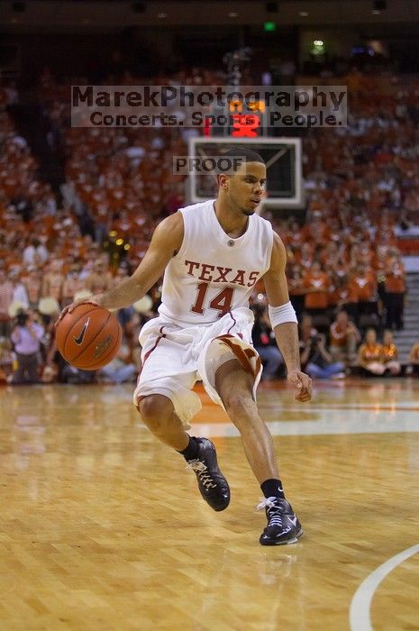 UT junior A.J. Abrams (#3, G) playing defense against a Kansas player. The University of Texas (UT) Longhorns defeated the University of Kansas Jayhawks 72-69 in Austin, Texas on Monday, February 11, 2008.
Filename: SRM_20080211_2120446.jpg
Aperture: f/2.8
Shutter Speed: 1/640
Body: Canon EOS-1D Mark II
Lens: Canon EF 80-200mm f/2.8 L