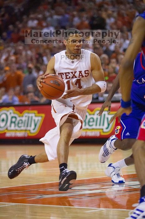 UT junior A.J. Abrams (#3, G) playing defense against a Kansas player. The University of Texas (UT) Longhorns defeated the University of Kansas Jayhawks 72-69 in Austin, Texas on Monday, February 11, 2008.
Filename: SRM_20080211_2133304.jpg
Aperture: f/2.8
Shutter Speed: 1/640
Body: Canon EOS-1D Mark II
Lens: Canon EF 80-200mm f/2.8 L