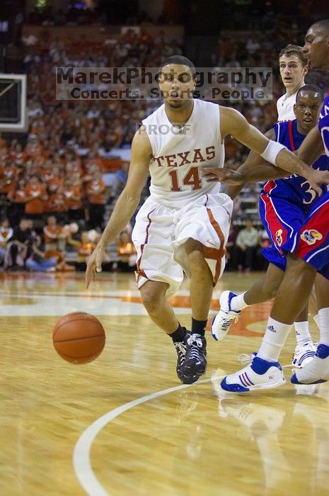 UT junior A.J. Abrams (#3, G) playing defense against a Kansas player.  The University of Texas (UT) Longhorns defeated the University of Kansas Jayhawks 72-69 in Austin, Texas on Monday, February 11, 2008.

Filename: SRM_20080211_2135066.jpg
Aperture: f/2.8
Shutter Speed: 1/640
Body: Canon EOS-1D Mark II
Lens: Canon EF 80-200mm f/2.8 L