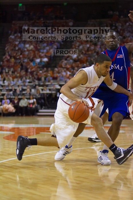 UT sophomore D.J. Augustin (#14, G) makes a drive past KU sophomore Sherron Collins (#4, Guard).  The University of Texas (UT) Longhorns defeated the University of Kansas Jayhawks 72-69 in Austin, Texas on Monday, February 11, 2008.

Filename: SRM_20080211_2142242.jpg
Aperture: f/2.8
Shutter Speed: 1/640
Body: Canon EOS-1D Mark II
Lens: Canon EF 80-200mm f/2.8 L