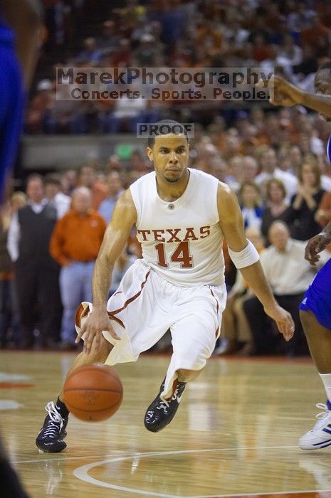 UT junior A.J. Abrams (#3, G) playing defense against a Kansas player. The University of Texas (UT) Longhorns defeated the University of Kansas Jayhawks 72-69 in Austin, Texas on Monday, February 11, 2008.
Filename: SRM_20080211_2145260.jpg
Aperture: f/2.8
Shutter Speed: 1/640
Body: Canon EOS-1D Mark II
Lens: Canon EF 80-200mm f/2.8 L
