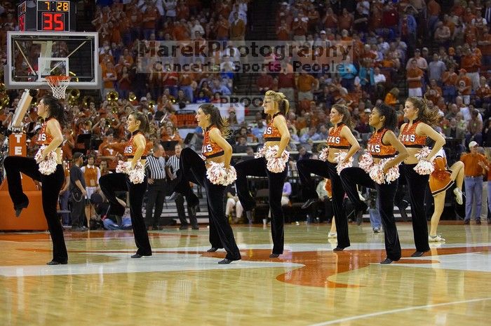 Texas Pom.  The University of Texas (UT) Longhorns defeated the University of Kansas Jayhawks 72-69 in Austin, Texas on Monday, February 11, 2008.

Filename: SRM_20080211_2148540.jpg
Aperture: f/2.8
Shutter Speed: 1/640
Body: Canon EOS-1D Mark II
Lens: Canon EF 80-200mm f/2.8 L