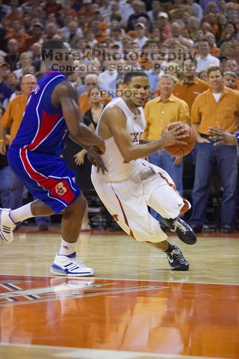 UT junior A.J. Abrams (#3, G) playing defense against a Kansas player. The University of Texas (UT) Longhorns defeated the University of Kansas Jayhawks 72-69 in Austin, Texas on Monday, February 11, 2008.
Filename: SRM_20080211_2155367.jpg
Aperture: f/2.8
Shutter Speed: 1/640
Body: Canon EOS-1D Mark II
Lens: Canon EF 80-200mm f/2.8 L